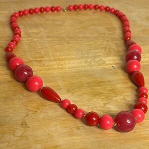 Pink and red circular beaded acrylic fashion statement necklace 31”
